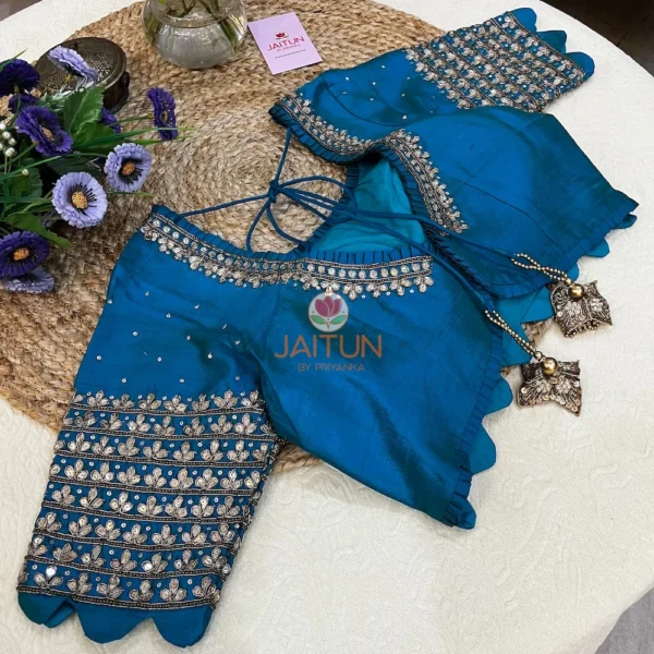 Detailed shot of the embellished neckline on Royal Blue Kundan Silk Blouse, highlighting kundan stones and shimmering sequins for bridal wear.