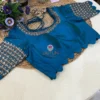 Front view of Royal Blue Kundan Silk Blouse with intricate kundan embroidery, designer neckline, and peplum detail, ideal for wedding and bridal ensembles.