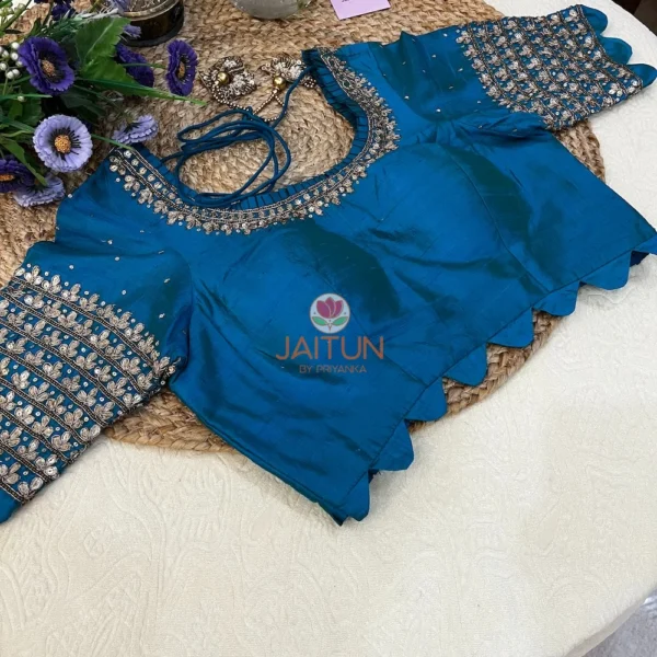 Front view of Royal Blue Kundan Silk Blouse with intricate kundan embroidery, designer neckline, and peplum detail, ideal for wedding and bridal ensembles.