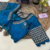 Close-up of Royal Blue Kundan Silk Blouse sleeve featuring elaborate kundan handwork and sequin embroidery, perfect for wedding occasions.