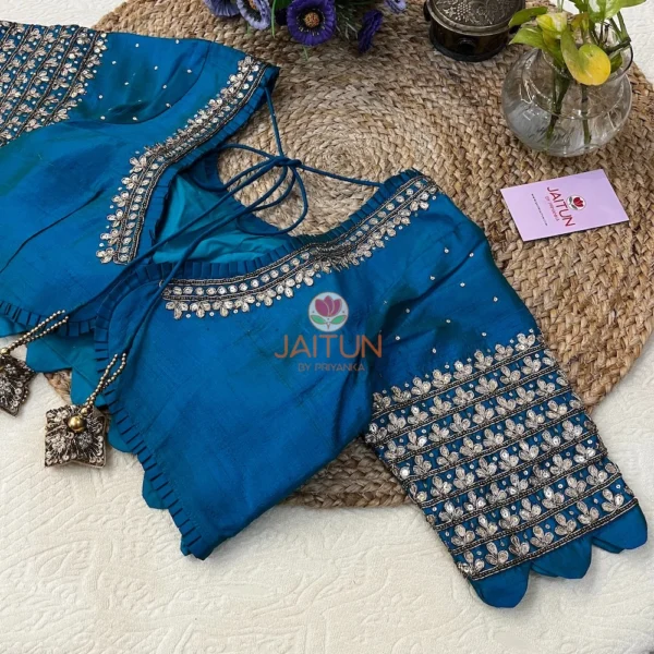 Close-up of Royal Blue Kundan Silk Blouse sleeve featuring elaborate kundan handwork and sequin embroidery, perfect for wedding occasions.