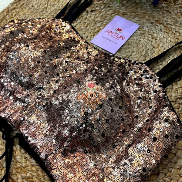 Close-up view highlighting the intricate rose gold sequin work and fine craftsmanship on the Midnight Rose Sequin Bustier Blouse.