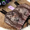 Side view of Midnight Rose Sequin Bustier Blouse displaying black tie closure with beaded tassels and sparkling sequin fabric.