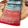 Sea Green Banarasi Silk Saree Border Close-Up Close-up view of maroon zari border on Sea Green Banarasi Silk Saree with floral motifs