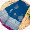 Teal blue pure Banarasi silk saree showing silver zari buta motifs and zari border.