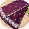 Deep wine Banarasi silk saree showing silver zari floral buti motifs across the body.