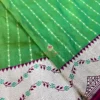 Leaf Green Banarasi Silk Saree Border Close-Up Close-up of the Leaf Green Banarasi Silk Saree showcasing the intricate floral woven Banarasi border and fine craftsmanship