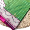 Leaf Green Banarasi Silk Saree Folded View Folded view of the Leaf Green Banarasi Silk Saree highlighting its elegant woven motifs, decorative border and magenta pallu