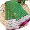 Leaf Green Banarasi Silk Saree Top View Top view of the Leaf Green Banarasi Silk Saree with floral Banarasi border, woven detailing and luxurious silk finish