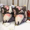 Luxury Crane Garden Cushion Cover with detailed crane embroidery, floral print, and decorative white tassels.