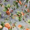 Bluebell Blossom Bedsheet – Botanical Print Detail Close-up of Bluebell Blossom bedsheet showing orange and blue flowers with green botanical leaves