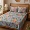 bluebell-blossom-printed-double-bedsheet-detail-0n-bed Placed on bed Bluebell Blossom double bedsheet featuring blue, orange and green floral botanical print