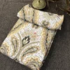 Desert Royale Bedsheet – Folded Set Desert Royale bedsheet folded set featuring beige, mustard and olive ornamental floral print