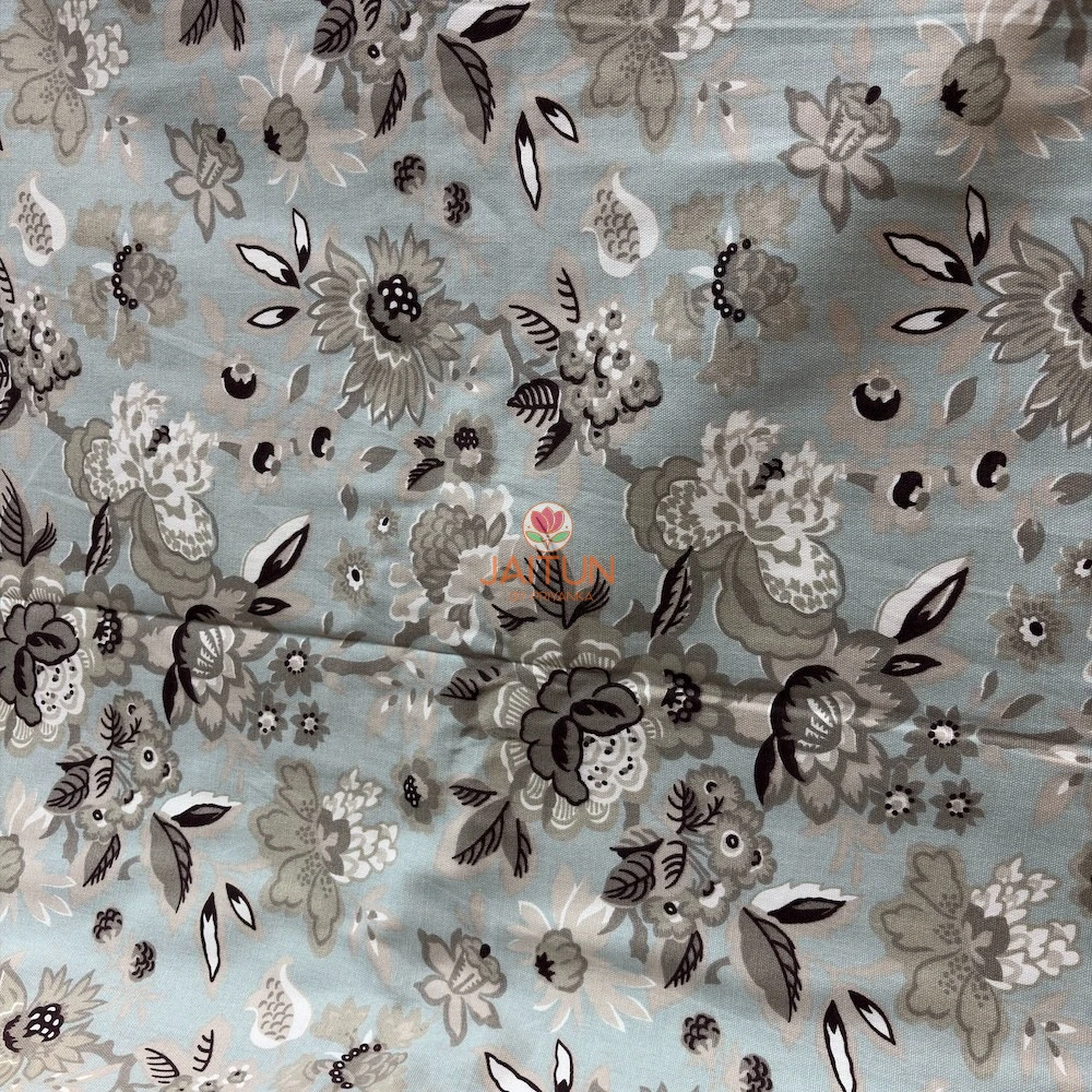 Cloud Petals Bedsheet – Floral Print Detail Close-up of Cloud Petals bedsheet showing large grey, ivory and dark floral motifs on a soft pastel blue base