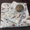 Cloud Petals Bedsheet – Folded Set Folded Cloud Petals bedsheet set featuring soft blue, grey and ivory floral print by Jaitun