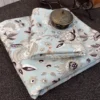 Cloud Petals Bedsheet with 2 Pillow Covers Cloud Petals double bedsheet displayed on a bed with two matching floral pillow covers by Jaitun