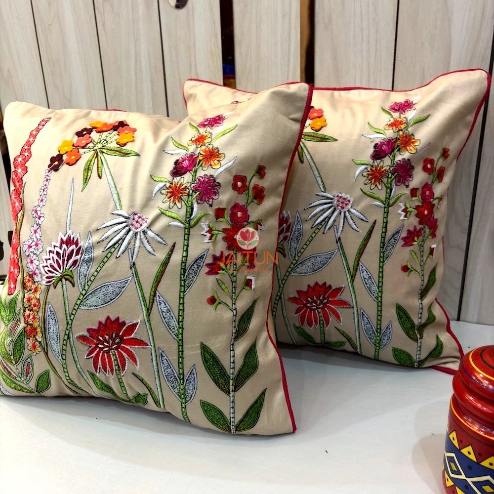 Flora Royal embroidered floral cushion covers styled together with colorful botanical artwork and luxury finish