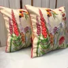 Flora Royal decorative cushion cover showcasing detailed floral embroidery and contrast red piping
