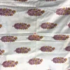 Close-up of mauve and mustard foliage print on Foliage Petals Ivory bedsheet