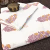 Close-up fabric view of Foliage Petals Ivory bedsheet with floral foliage motifs