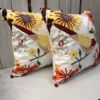 Golden Finch Garden Cushion Cover – Side Angle View Golden Finch Garden Cushion Cover side angle showcasing detailed bird embroidery, floral accents, and decorative corner tassels.