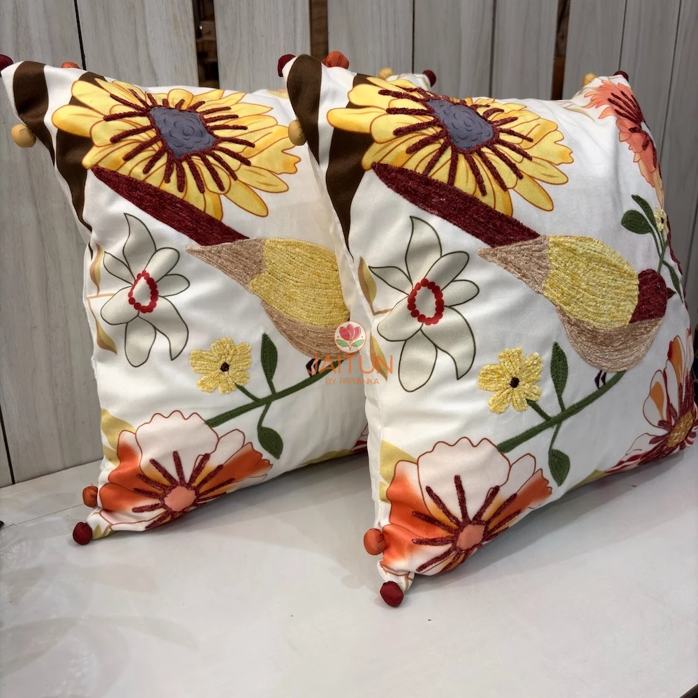 Golden Finch Garden Cushion Cover – Side Angle View Golden Finch Garden Cushion Cover side angle showcasing detailed bird embroidery, floral accents, and decorative corner tassels.