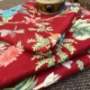 Close-up of Gulzar Bloom Wine Red Bedsheet featuring floral, foliage and dragonfly motifs