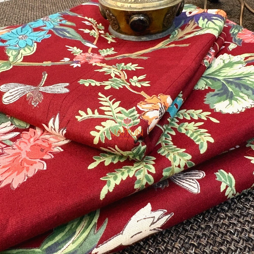 Close-up of Gulzar Bloom Wine Red Bedsheet featuring floral, foliage and dragonfly motifs