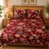 Gulzar Bloom Wine Red Double Bedsheet with multicolor floral and dragonfly print placed on bed