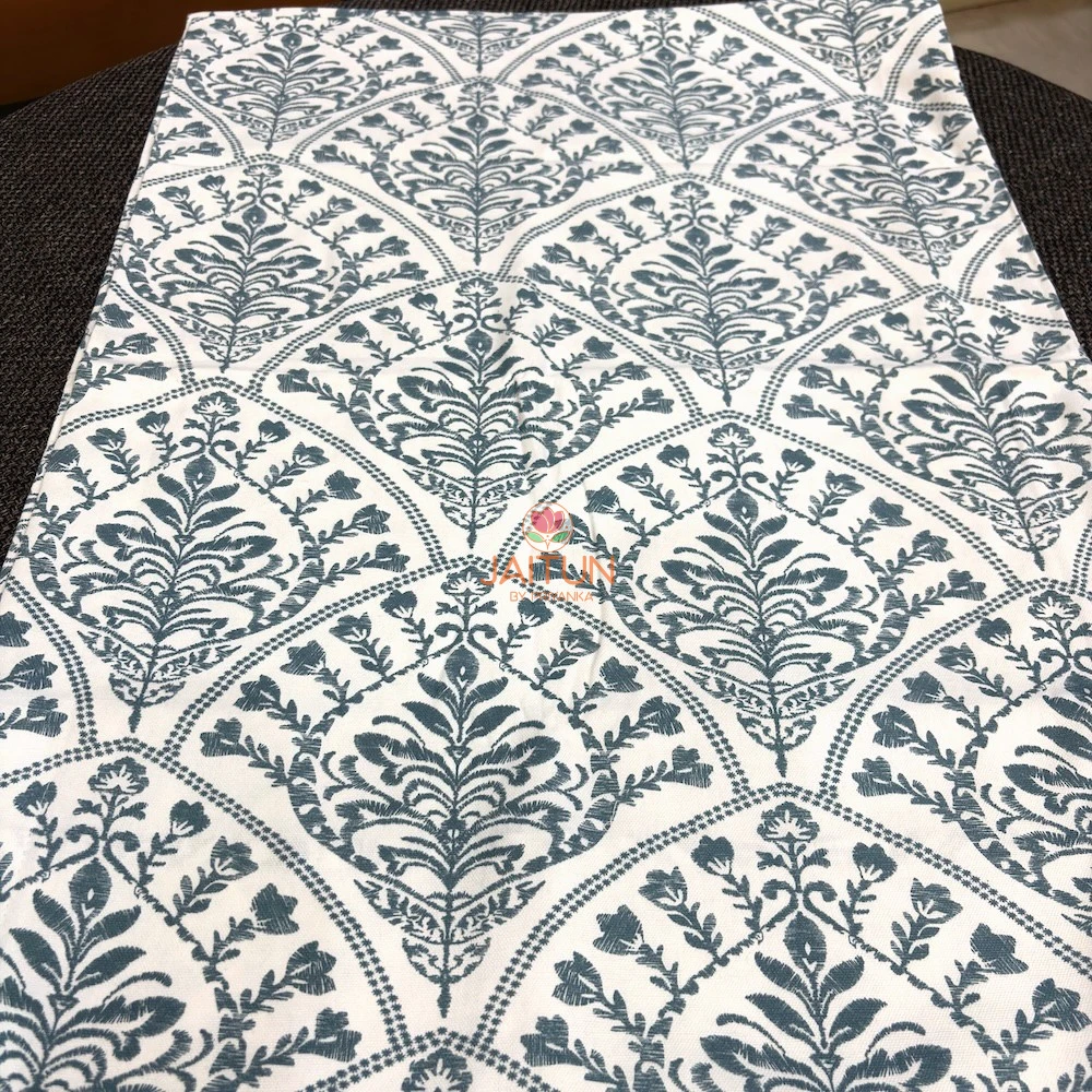 Indigo Fern Bedsheet neatly folded to showcase its intricate botanical print and fabric design