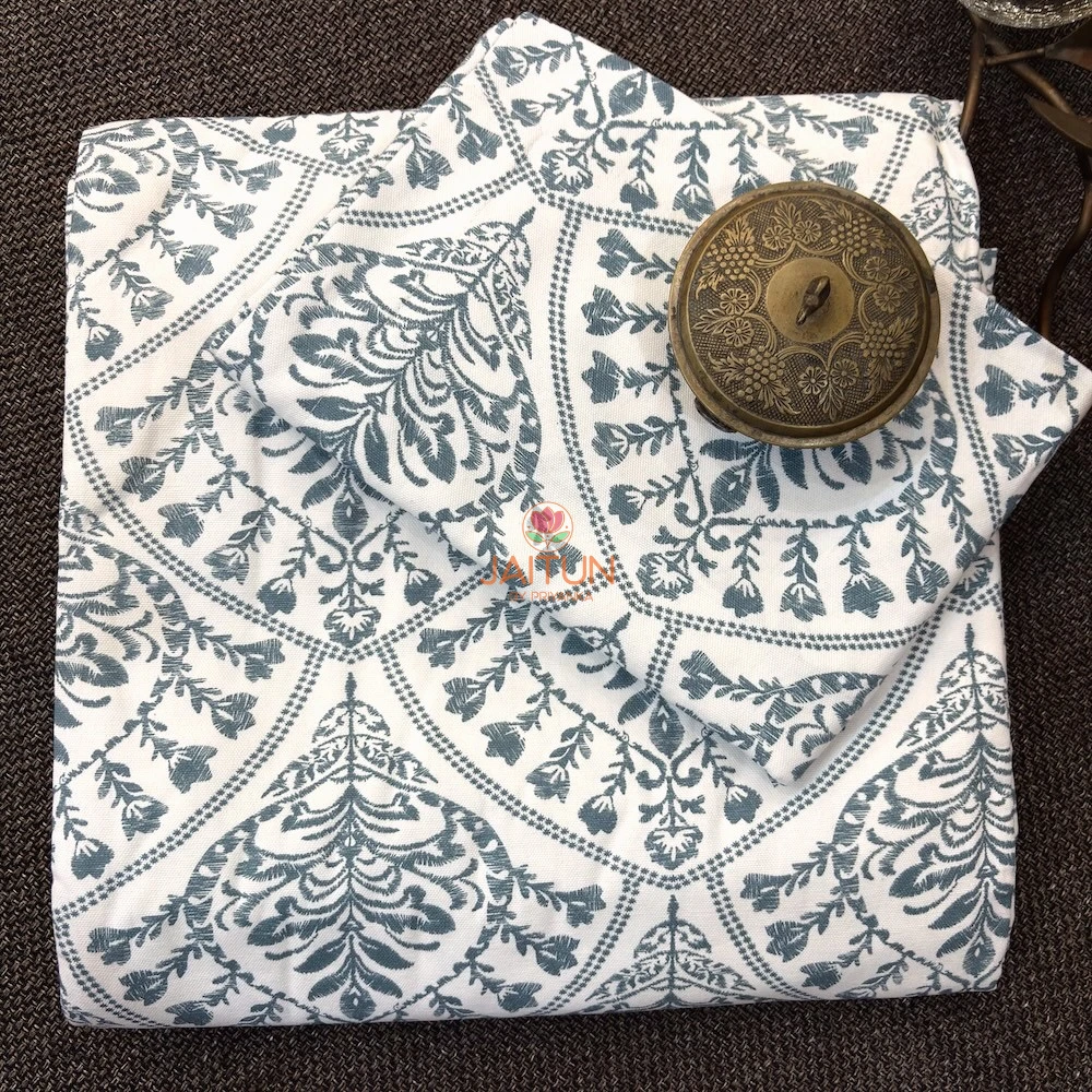 Folded Indigo Fern Bedsheet featuring an ivory base with elegant indigo botanical motifs