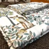 Little Deer Meadow Bedsheet – Fabric Detail Close-up of Little Deer Meadow bedsheet showing deer and woodland botanical print