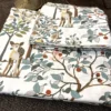 Little Deer Meadow Bedsheet – Folded View Little Deer Meadow printed bedsheet featuring deer, trees and botanical motifs