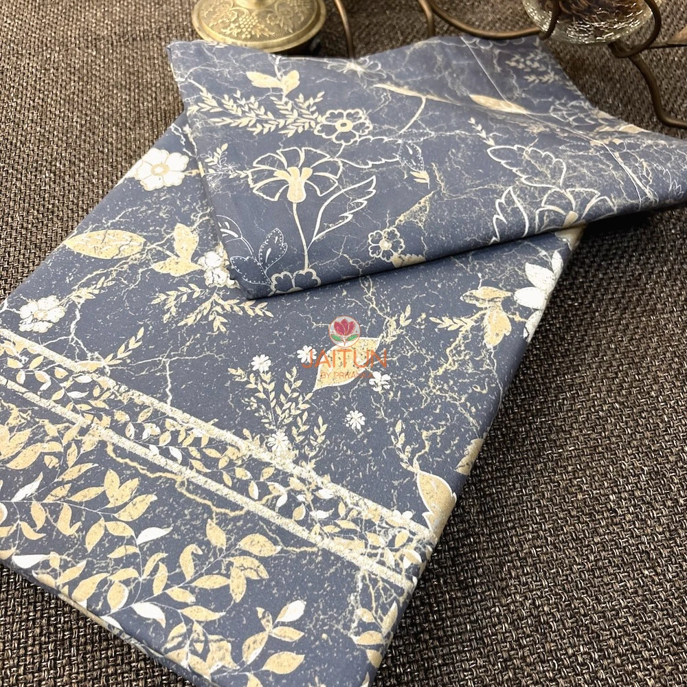 Moonlit Meadow slate blue bed sheet with delicate beige botanical print and leafy border detailing
