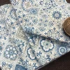 Close-up fabric view of Moroccan Mist Bed Sheet featuring detailed blue, sage and ivory motifs