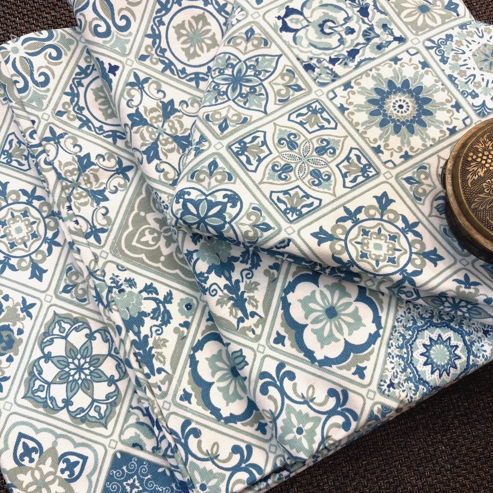 Close-up fabric view of Moroccan Mist Bed Sheet featuring detailed blue, sage and ivory motifs