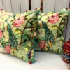 Luxury Emerald Peacock Blossom Embroidered Cushion Covers styled in an elegant home décor setting