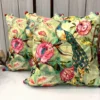 Pair of Emerald Peacock Blossom Embroidered Cushion Covers with vibrant floral artwork and peacock-inspired design