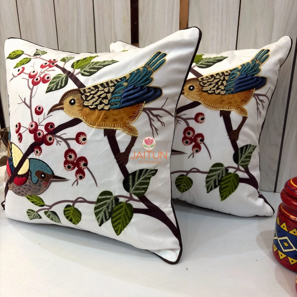 Songbirds Embroidered Cushion Cover – Angled View Angled view of Songbirds Embroidered Cushion Cover with detailed bird motifs and nature-inspired embroidery