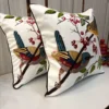Songbirds Embroidered Cushion Cover – Pair Display Pair of Songbirds Embroidered Cushion Covers showcasing colorful bird embroidery and botanical branch detailing