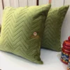Angled view of Sage Green Velvet Luxe Zigzag Cushion Cover highlighting soft velvet chevron pattern