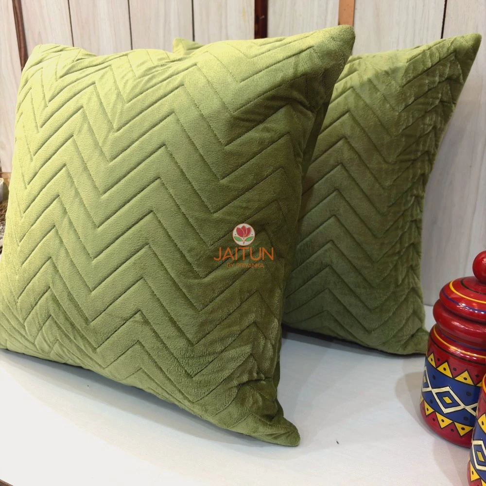 Angled view of Sage Green Velvet Luxe Zigzag Cushion Cover highlighting soft velvet chevron pattern
