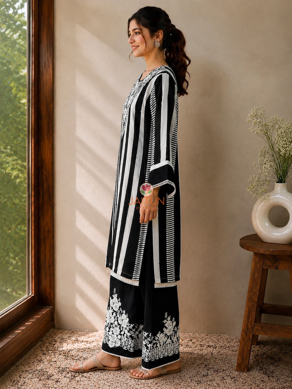 Black Ivory Elegance Kurta Set – Side View Black Ivory Elegance Kurta Set side view with striped kurta and embroidered pants